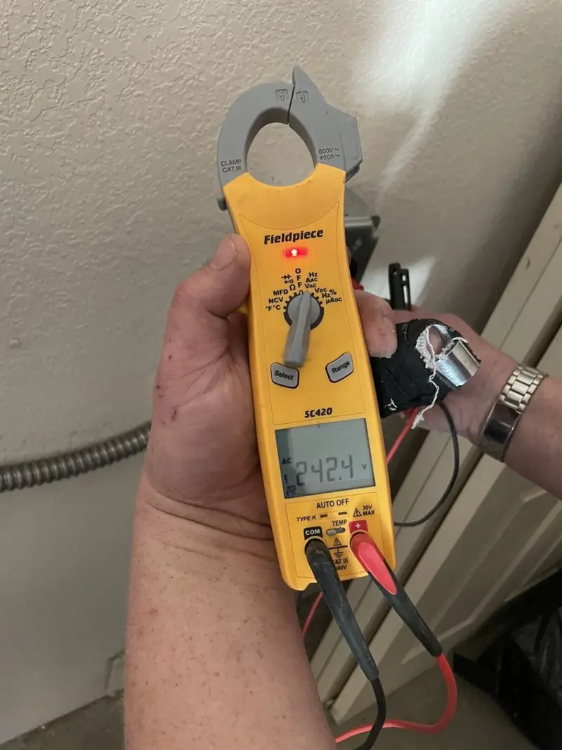 Voltage testing with clamp meter during Outlet Installation in Elk Plain